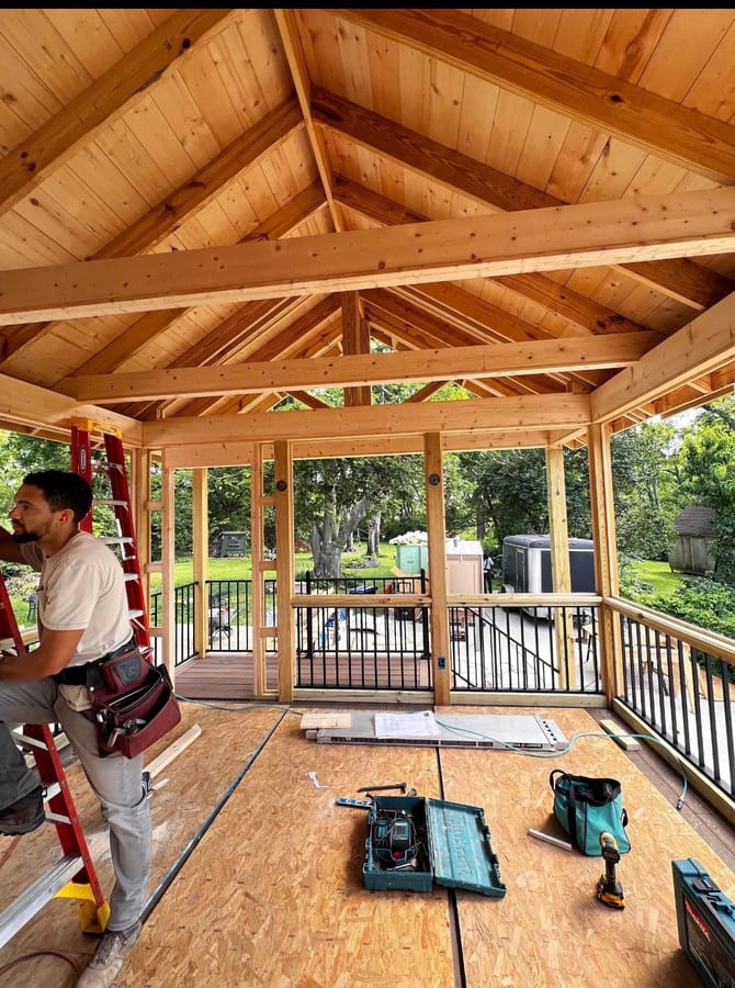 Southpine Design covered porch framing with a timber ceiling, aluminum railing, and electrical rough-in