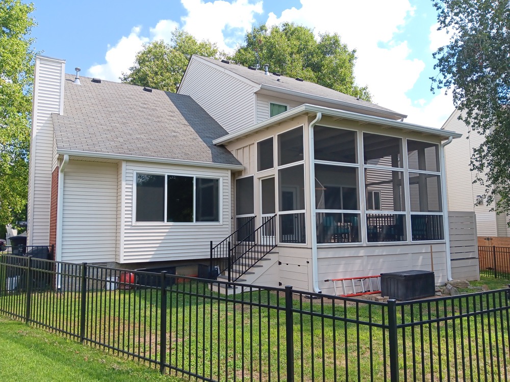 Southpine Design screened porch addition with tall screen panels and a stair entry